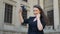 Slow motion of attractive woman taking video selfie while waving her beautiful brown hair