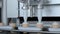 Slow motion: automatic filling machine on ice-cream dairy factory during work