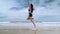 Slow motion,Beautiful Asian women jumping on the beach, freedom concept