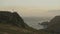 Slow Motion Beautiful Evening Rocky Coastal Landscape with Colourful Skies, Puffin Colony Flying in