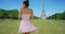 Slow motion of carefree Latina tourist enjoying view of Eiffel Tower