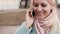 Slow motion Caucasian woman chatting on the phone. Lovely attractive young 20s happy blonde ending call saying goodbye.