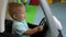 Slow motion. Child steers wheel in toy car. Childrenâ€™s play center. Boy drives toy car