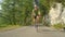 SLOW MOTION: Cinematic shot of male road biker during his difficult climb.