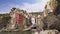 slow motion of Cinque Terre coast in Liguria, Italy. Sea, characteristic colored building, people laying on seaside