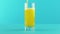 Slow motion close-up shot of fruit fizzy orange soda cold beverage drink pooring into low glass blue background in