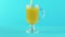 Slow motion close-up shot of fruit orange multifruit juice cold beverage drink pooring into latte glass mug blue