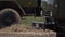 Slow motion close-up shot of spinning wheels of a military trucks