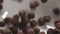 Slow motion closeup chocolate cereal balls falling into white bowl