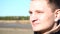 Slow motion closeup portrait of guy young man who frown enjoy sun outdoor