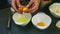 Slow motion closeup woman hands separate yolk from protein of single raw egg
