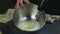 Slow motion closeup woman hands whisking by whisk egg whites in deep metal bowl