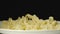 SLOW MOTION: Cooked figural pasta fall into full plate