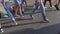 Slow motion of a crowd of people crossing the street