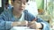 Slow motion of Cute asian boy doing your homework with angry face. 4K