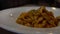 Slow motion of dish of spaghetti bolognese on the table of the restaurant.