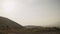 Slow motion driving plate side view from a car of Armenia landscape with mountains and hills in autumn