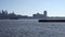 Slow Motion East river, Tug boat with barge on River in NYC. Slowmotion waves