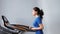 Slow motion fitness Asian woman doing cardio running on treadmill at gym or home medium shot