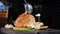 Slow motion food video footage. Chef in gloves decorates ready meat dish with a pickled tomato. Steak with vegetables on