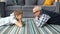 Slow motion of grandfather and grandson talking relaxing on floor at home