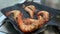 Slow-motion of grilling prawn or shrimp on ignited pan. Homemade cooking.