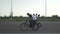 Slow motion of group of teenage bikers performing jump tricks and bunny hop using bicycles on bike track -
