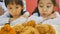 Slow motion of Happy Asian girls with fried chicken in restaurant