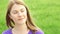 Slow Motion Happy Smiling Young Woman Enjoying Nature. Sitting on bench in green park. Freedom loneliness concept