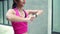 Slow motion - Healthy beautiful young Asian Athlete women sports clothing legs warming and stretching her arms to ready for run.