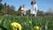 Slow motion of kids having fun gathering eggs at Easter hunt