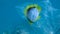Slow motion, Live Blackback Butterflyfish trapped to the plastic bag and is trying to swim out of it, on blue water background. Pl