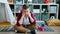 Slow motion of lonely child sitting on floor in playroom feeling miserable and bored