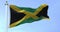 Slow motion loop of Jamaica national flag waving in the wind on a clear day