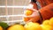 Slow motion low angle shot young man takes tangerines