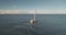 Slow motion of luxury yacht sailing at ocean bay aerial. Passenger sailboat race at open sea