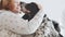 Slow motion. A male veterinarian in a white coat inoculates a spotted spaniel held by his owner. Vaccination. Close up