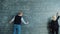 Slow motion of man and woman writing formulas on blackboard in university class