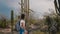 Slow motion medium shot, happy young tourist woman hiking at amazing wild cactus desert in Arizona national park USA.