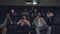 Slow motion of multiethnic group of students watching film in cinema eating