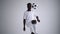 Slow motion: one african man soccer player white jersey juggling in silhouette on white background. One black Brazilian