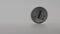 Slow Motion physical metal silver Litecoin currency rolling white background-Dan