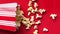 Slow motion of Pop Corn falling on a red background at 120 fps