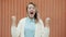 Slow motion portrait of crazy woman screaming and gesturing expressing rage outdoors