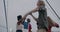 Slow motion portrait of excited student dancing at youth party on rooftop against evening sky background