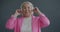 Slow motion portrait joyful Asian woman wearing wireless headphones dancing and listening to music enjoying leisure time