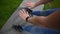 SLOW MOTION POV shot of woman reaching down to touch toes on an outdoor yoga mat on grass