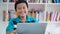 Slow motion of preteen boy studying with laptop