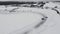Slow motion of a racing cars championship sliding on an ice track. Clip. Winter drift competitions, aerial view.