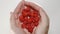 SLOW MOTION: Raspberris falls from a human hands to the milk in a dish